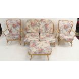 A light Ercol four piece suite comprising two seater sofa, two chairs and footstool (4) Condition