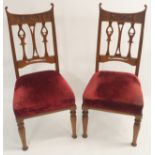 A pair of carved oak Arts and Crafts chairs (2) Condition Report: Available upon request