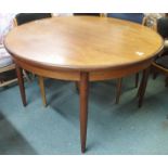 A G-plan teak extending dining table, 73cm high x 122cm diameter Condition Report: Available upon