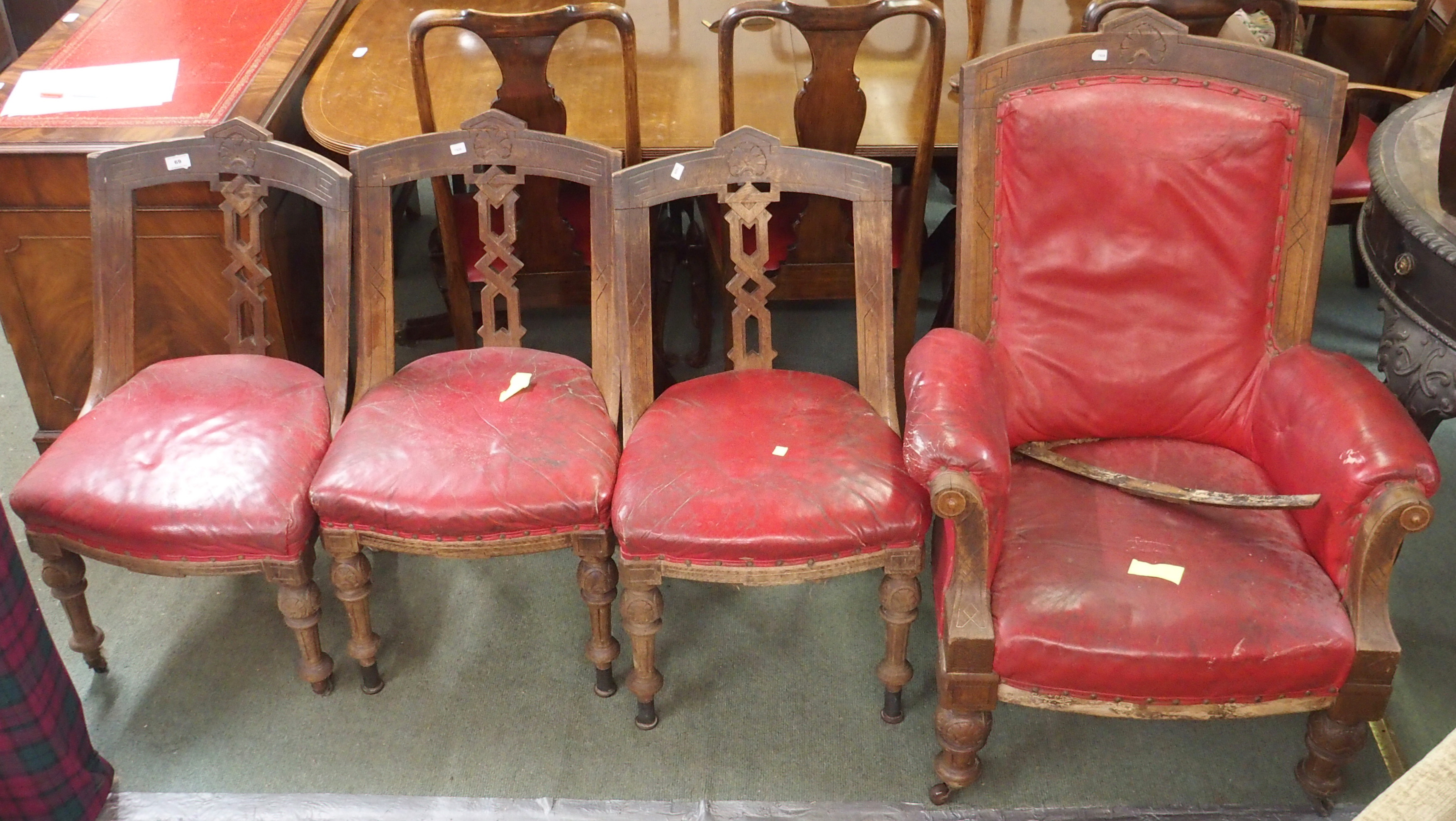 A Victorian armchair with red leather seat and back with three matching chairs (4) Condition Report: