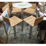A Pedrali glass topped table, 110cm high x 60cm diameter with four swivel bar chairs (5) Condition