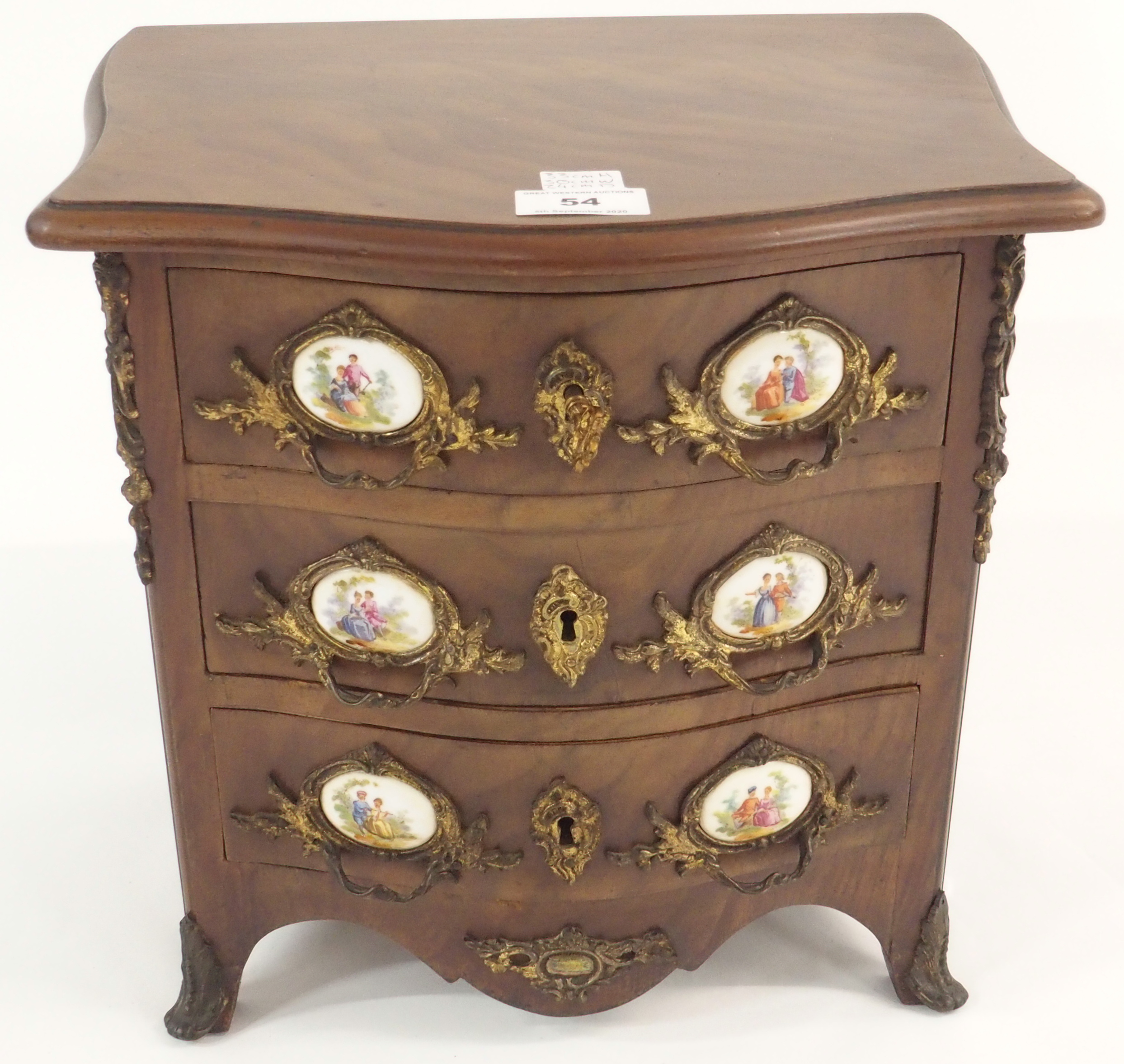 A miniature three drawer chest with ceramic plaques, 33cm high x 30cm wide x 24cm deep Condition