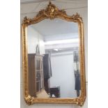 A modern ornate gilt wall mirror, 140cm high x 85cm wide Condition Report: Available upon request