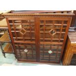 A mahogany glazed bookcase top, 139cm high x 130cm wide x 30cm deep Condition Report: Available upon