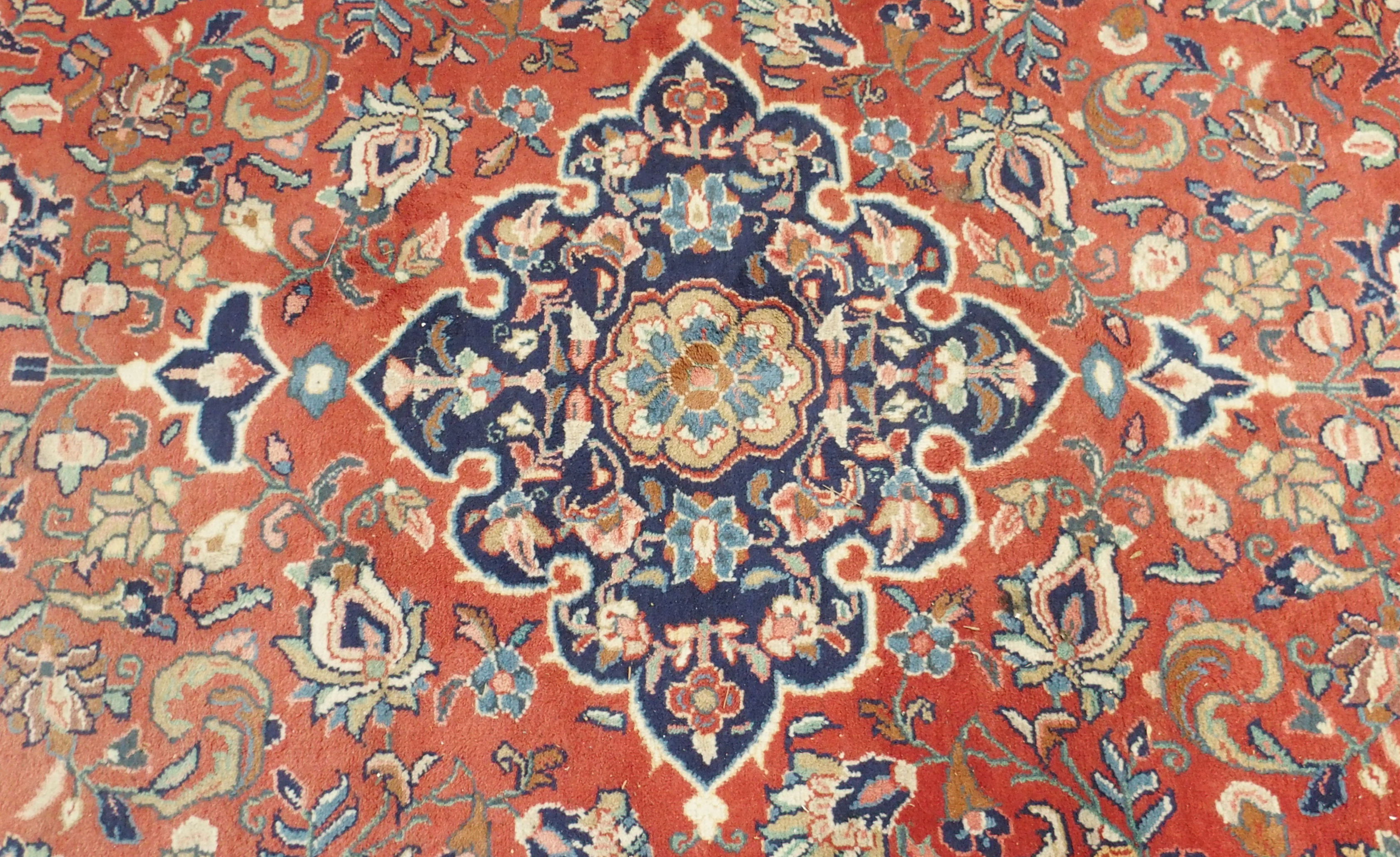 A red ground Keshan rug with blue central medallion, 342cm x 230cm Condition Report: Available - Image 2 of 5
