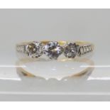 An 18ct and platinum three stone diamond ring set with estimated approx 0.30cts finger size N,