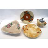 A Clarice Cliff crocus pattern plate, a Celtic Harvest preserve pot and cover, a similar plate and a