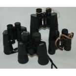 Four pairs of binoculars Condition Report: Available upon request