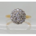 An 18ct vintage diamond cluster ring circa 1918, finger size N1/2 weight 4.3gms Condition Report: