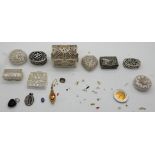 A lot comprising nine assorted filigree white metal pill boxes Condition Report: Available upon