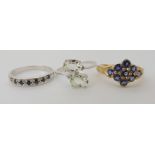 A 9ct iolite cluster ring, size N1/2, A 9ct white gold sapphire ring size N1/2, and a mint green