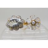 A 9ct gold green amethyst and white topaz ring size N1/2, and a 9ct gold white zircon flower ring