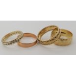 Three 9ct gold wedding rings, rose gold with Glasgow hallmarks M1/2, wide band M1/2, pierced