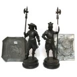 A pair of spelter figures of cavalier's, together with an Orivit pewter dish decorated with a boar