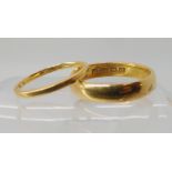 A 22ct gold wedding ring size P, and a thinner example size K1/2, combined weight 6.7gms Condition