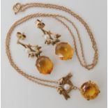 A 9ct gold citrine pendant necklet, length of pendant 2.7cm, length of chain 44cm, together with a