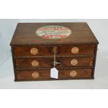 A haberdasher's 'Silcarn' oak three drawer chest with original advertising stickers, 33cm wide