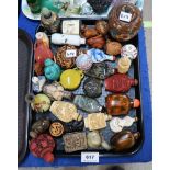 A collection of assorted snuff bottles and netsuke etc Condition Report: Available upon request