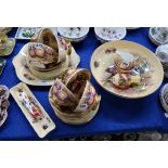 An Aynsley Orchard Gold teaset comprising large bowl, milk jug, sugar bowl, vase, six cups, saucers,