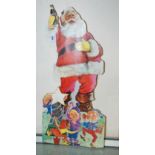 A Coco-Cola Christmas advertising sign, 71cm high Condition Report: Available upon request