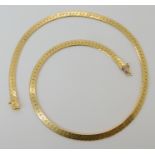 An 18ct gold flat chain necklace length 42cm, weight 26.7gms Condition Report: Available upon