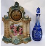 A pottery clock together with a blue flashed decanter and stopper Condition Report: Available upon