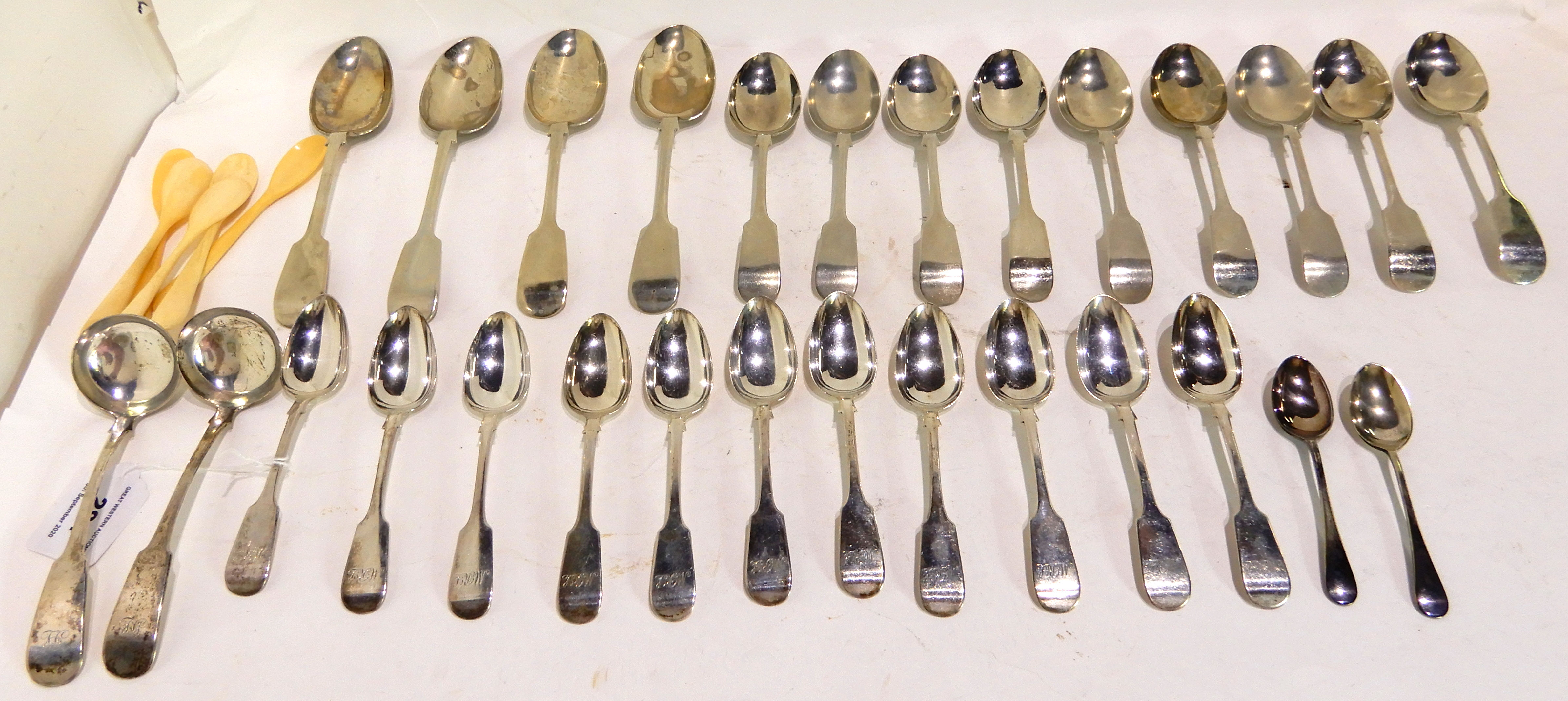 A lot comprising eleven silver teaspoons, Glasgow 1844 (224gms), a quantity of EP spoons, five