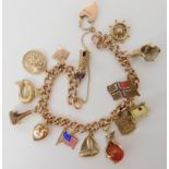 A 9ct gold curblink bracelet with heart shaped clasp and thirteen 9ct and yellow metal charms and