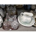 Assorted glassware, a three bottle Tantalus (unmarked) and a Bells pottery washbowl and ewer