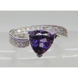 An 9ct white gold trilliant cut amethyst and diamond dress ring, diamonds estimated approx