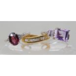 A 9ct white gold rhodolite garnet and white topaz ring size N, a 9ct amethyst and white topaz ring