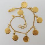 A bright yellow metal faux coin bracelet with Arabic hallmarks length 21cm, weight 7.7gms