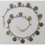 A white metal necklace with Shakudo plaques of birds, length 38cm Condition Report: No condition