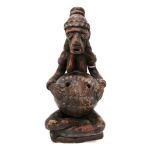 A terracotta tribal figure of a seated man Condition Report: Available upon request