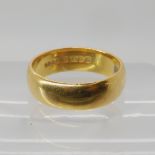 A 22ct gold wedding ring size L1/2, weight 5.4gms Condition Report: Available upon request
