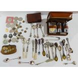 A lot comprising a travel toilet set, some EP cutlery and a quantity of commemorative crowns, medals