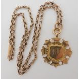 A 9ct gold medallion and vintage chain, weight 10.3gms Condition Report: Available upon request