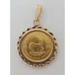 A 1/10 Krugerrand in yellow metal pendant mount weight 4.8gms Condition Report: Available upon