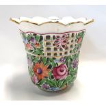 A Herend porcelain vase with pierced decoration and painted in colours Condition Report: Available