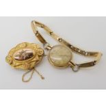 A 9ct gold Cyma watch head with gold plated expanding strap, and a diamond set 9ct brooch, weight