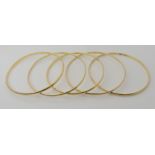 Five 18ct gold bangles, inner diameter approx 6.7cm, combined weight 51.5gms Condition Report: