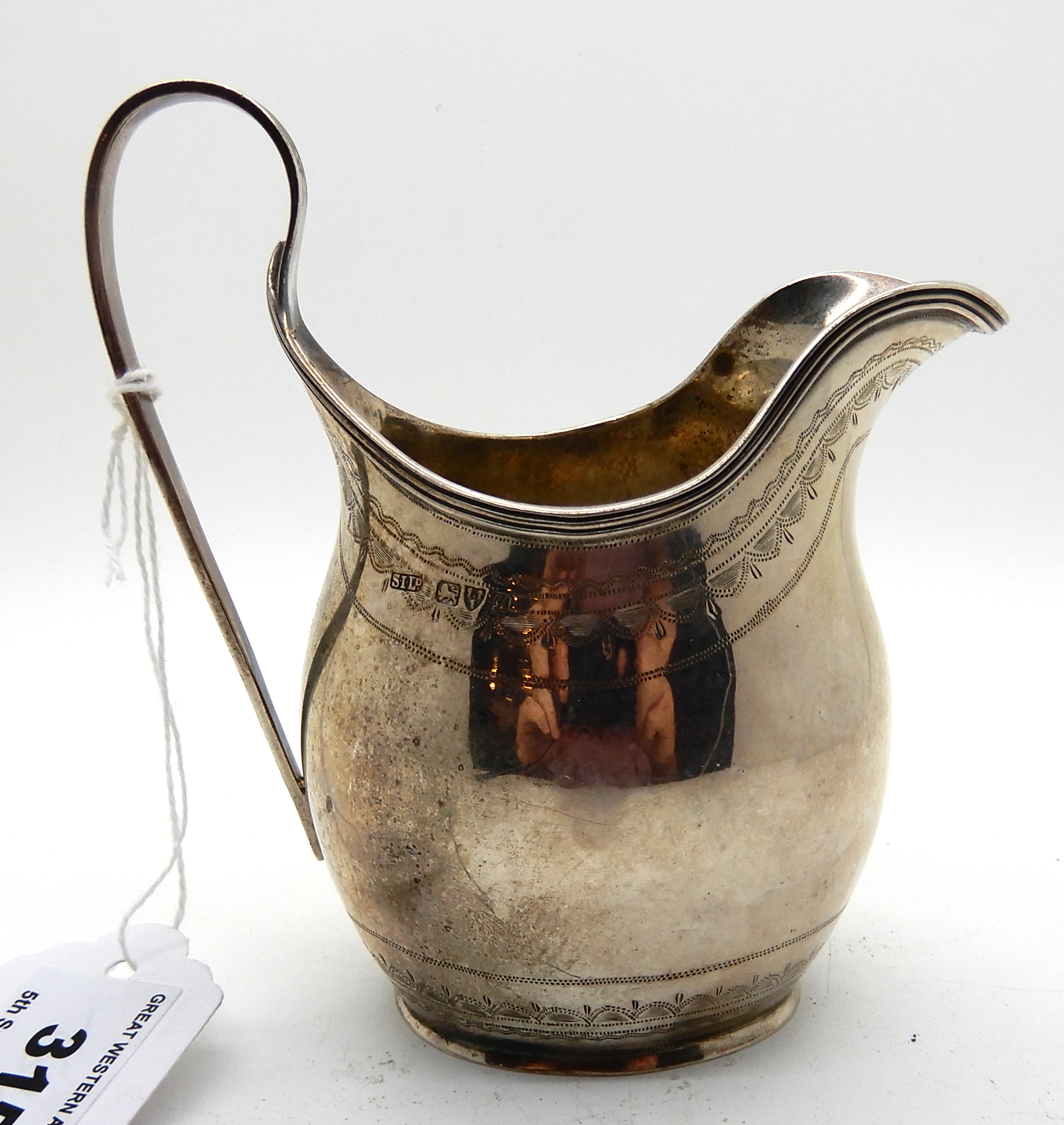 A silver cream jug, Chester 1924, 11cm high, 97gms Condition Report: Available upon request