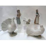 Two Lladro doves, a swan and two girls Condition Report:
