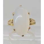 A bright yellow metal moonstone ring, moonstone approx 19mm x 10mm, ring size Q, weight 5.2gms