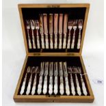 A cased twenty four piece EP and mother of pearl dessert cutlery set Condition Report: Available