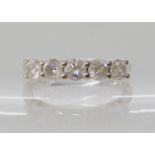 An 18ct white gold five stone diamond ring, estimated approx combined diamond content 0.80cts,