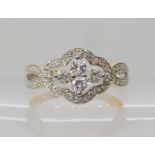 A 9ct fancy diamond cluster ring, set with estimated approx 0.57cts of brilliant cut diamonds,