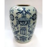 A Chinese celadon glazed jar with painted blue decoration, 29cm high Condition Report: Available