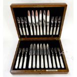 A cased twenty four piece EP and mother of pearl dessert cutlery set Condition Report: Available