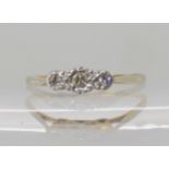 An 18ct and platinum three stone diamond ring, size Q, weight 1.8gms Condition Report: Available